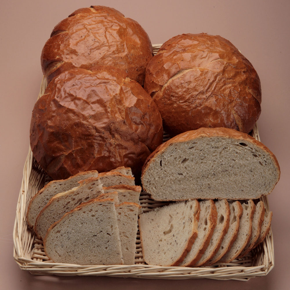 Basket full of Grandpa rye bread loaves