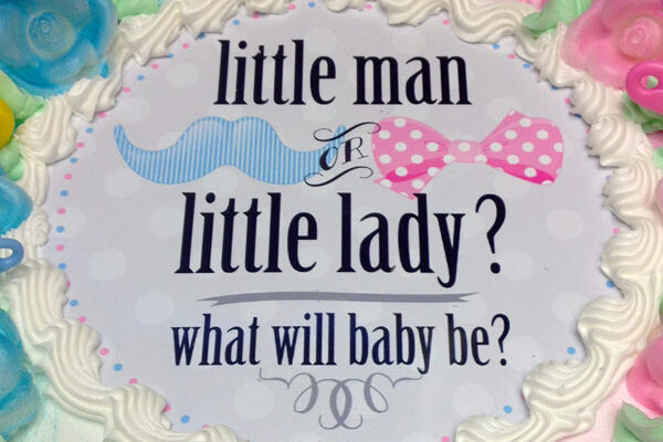 Little man or little lady, what will baby be? cake