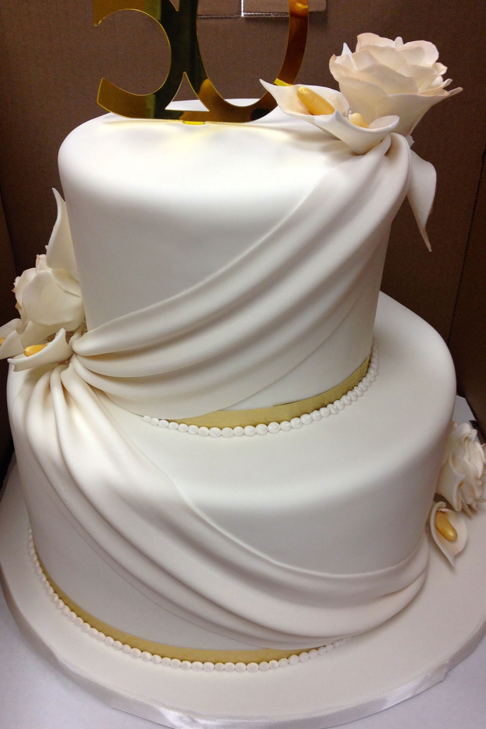 Wedding cake with Angled Drapes with Flower Clusters