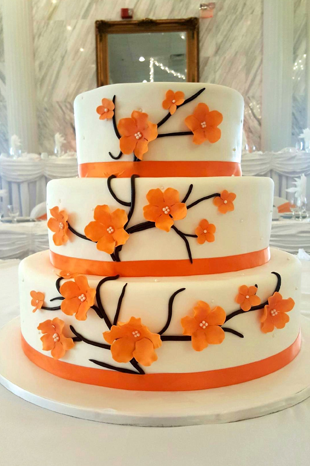 Wedding cake with Orange Cherry Blossoms