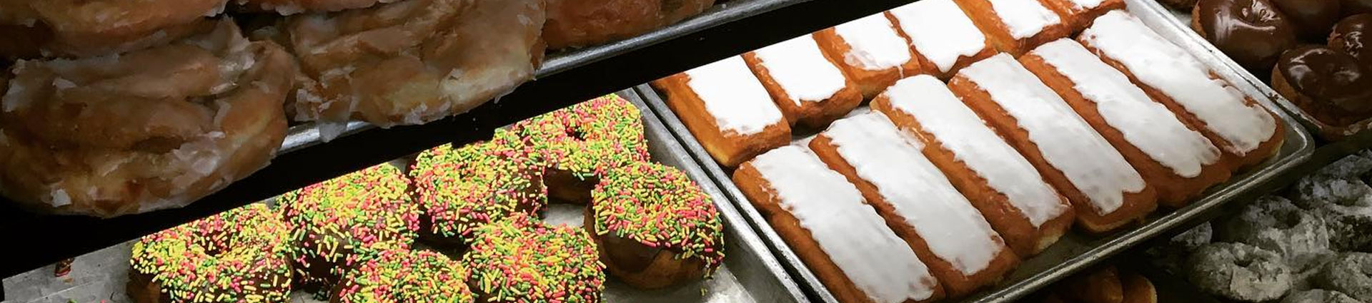 Sheet trays of doughnuts