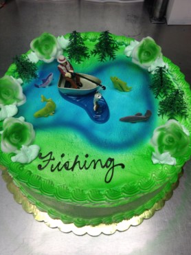 Decorated cake with fisherman and fish designs