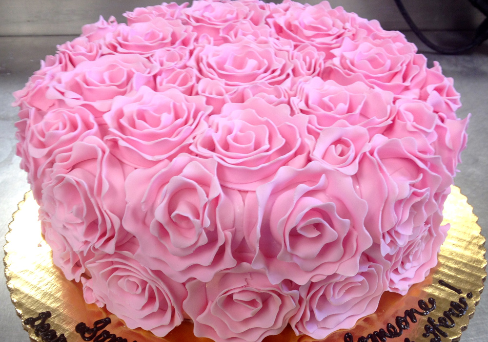 Pink cake with Fondant Rosettes