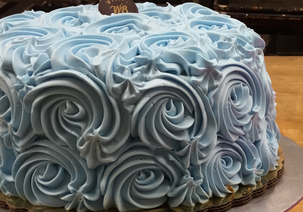 Light blue cake with Buttercream Rosettes