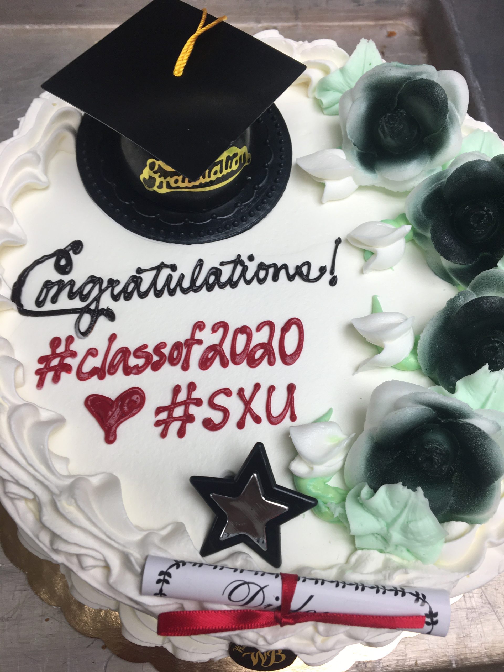 Classic cake with black cap and diploma